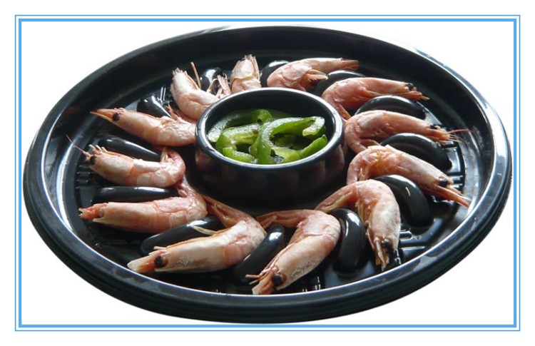 seafood tray of four small containers heating into microwave oven and airline food disposal container
